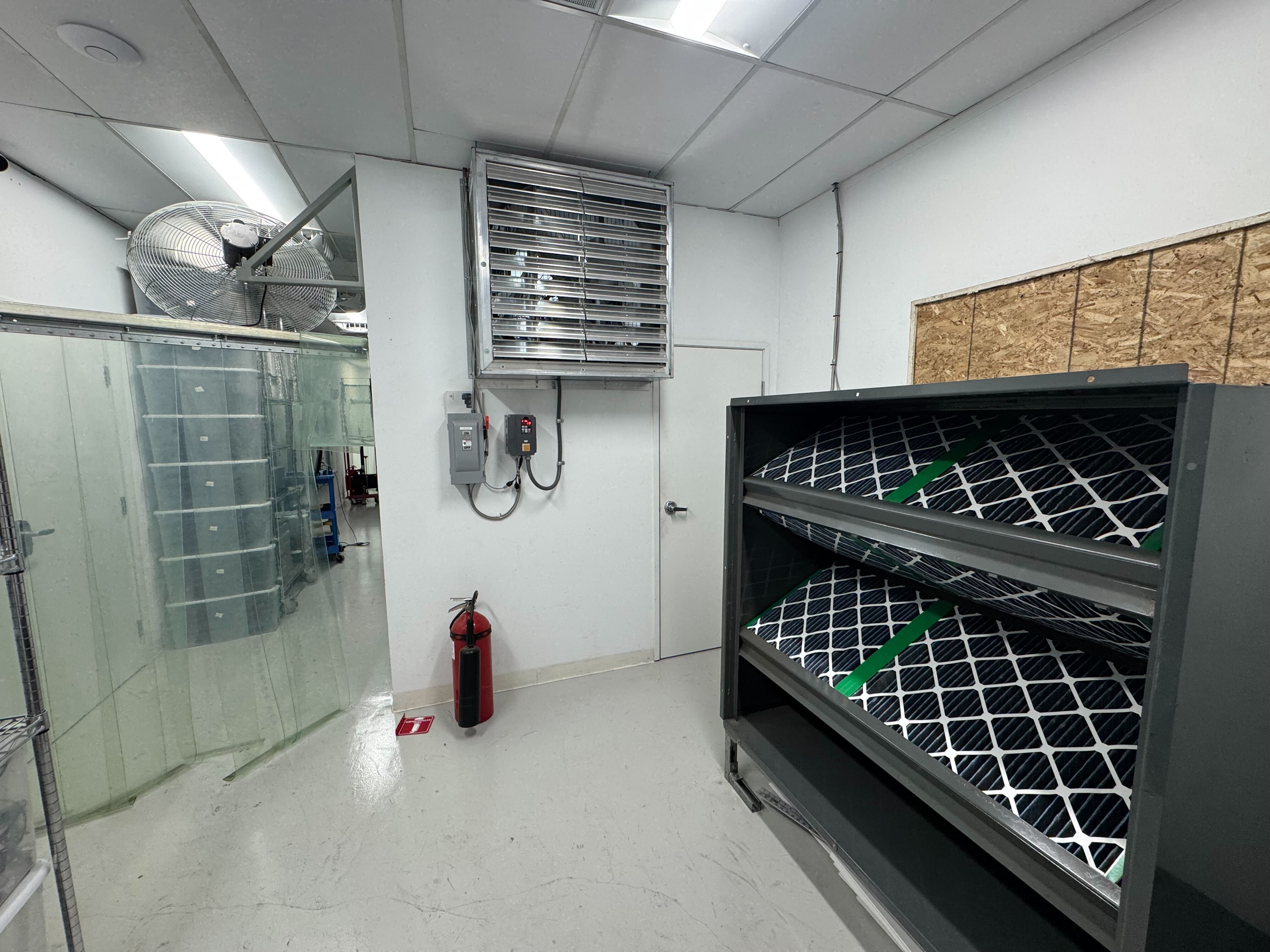 Filtered intake fan on right, 2 recirculating fans at the top