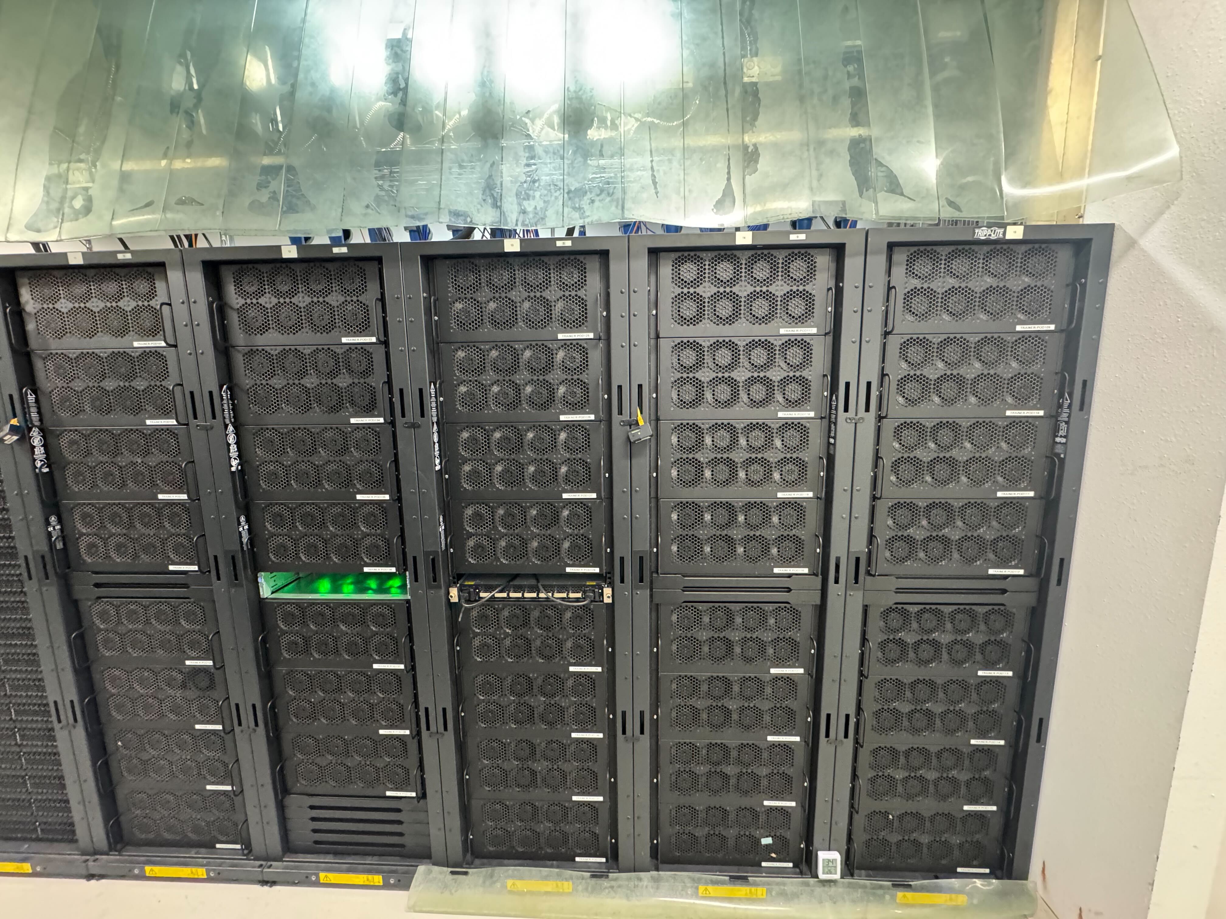 Our main training/compute machines. Notice the 400Gbps switch in the center.